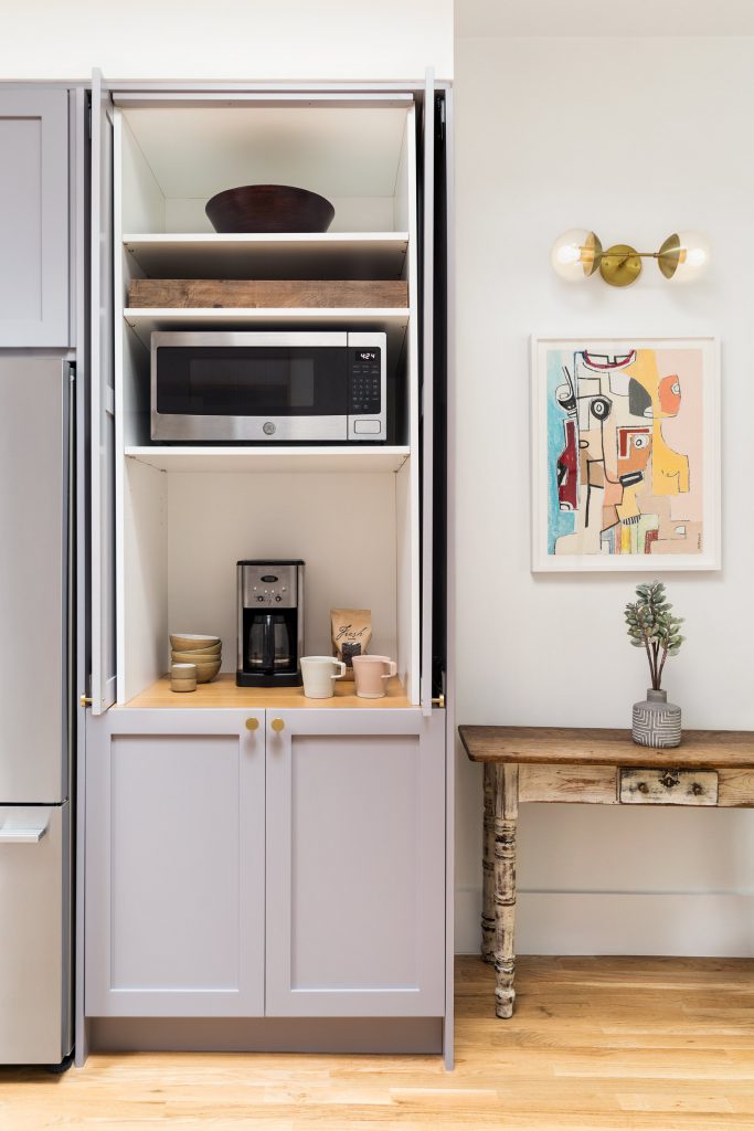 a coffee bar in a kitchen with purple cabinets