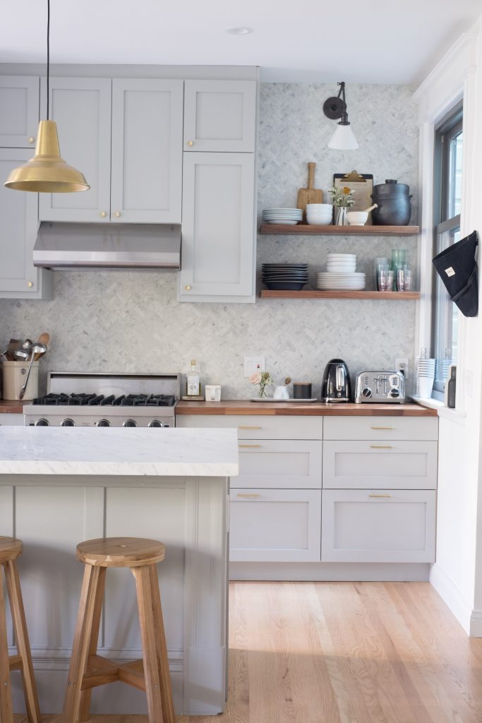 the kitchen has a peninsula where friends can sit.