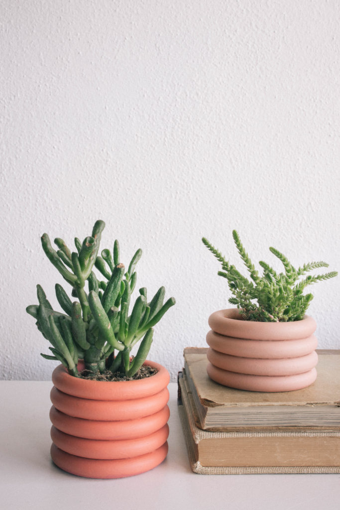 succulents in colorful stacked planters