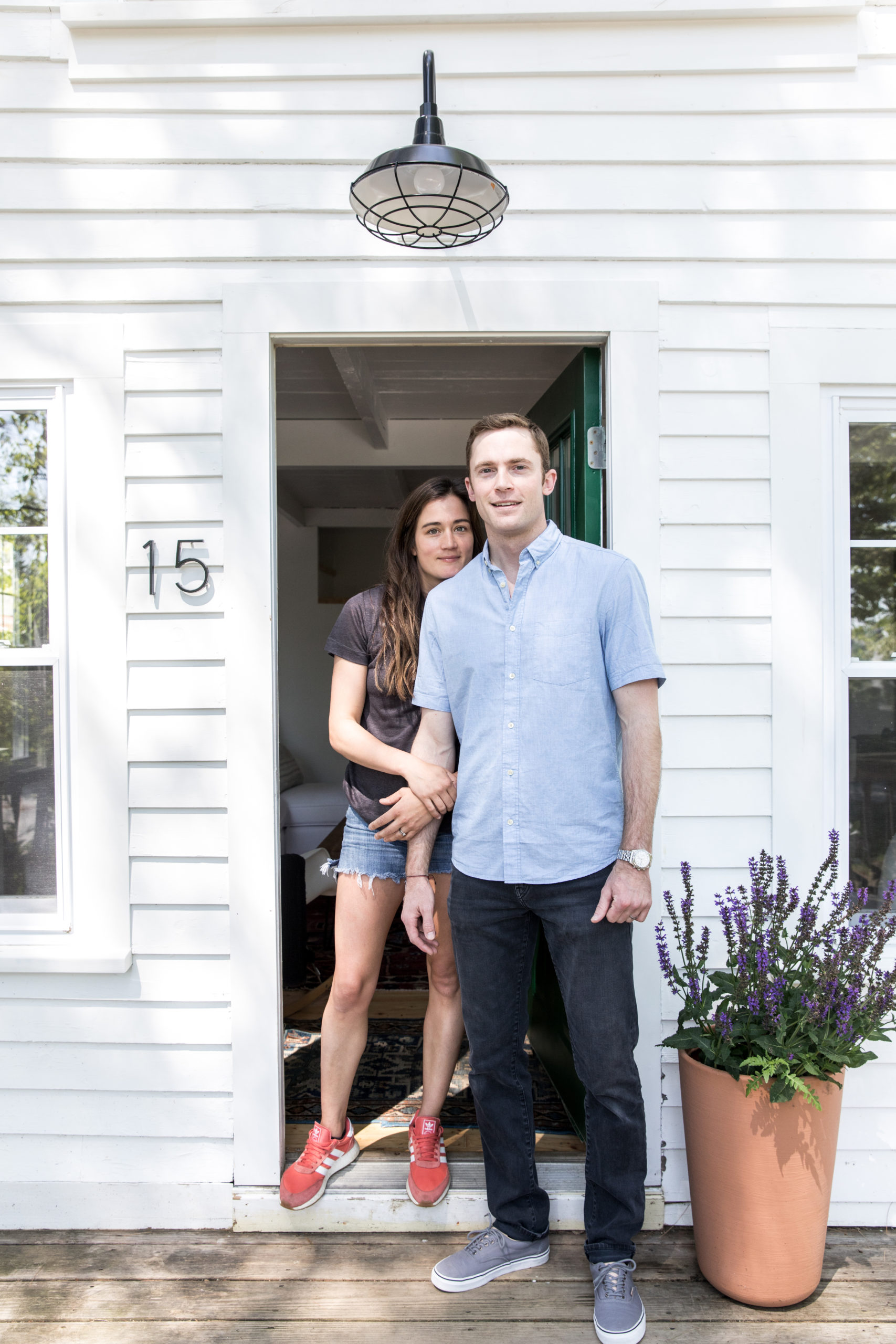Sarah Madeira Day and Wes Day in front of their house