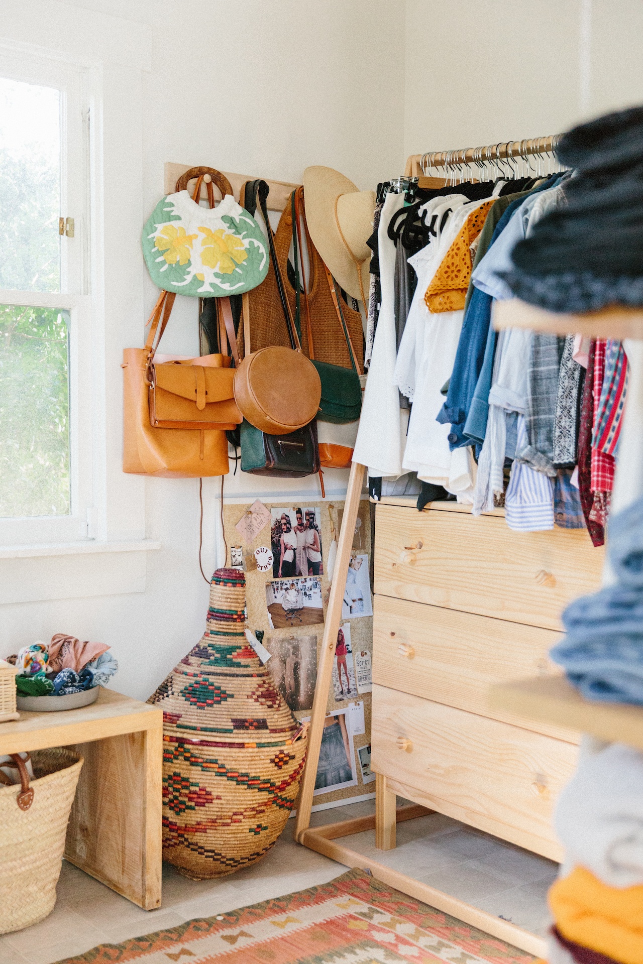 a closet with hanging bags