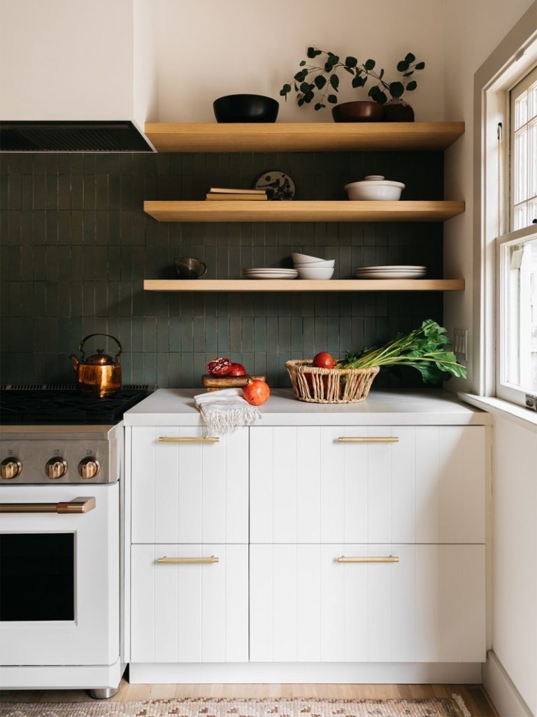 open shelving against a green tile backsplash