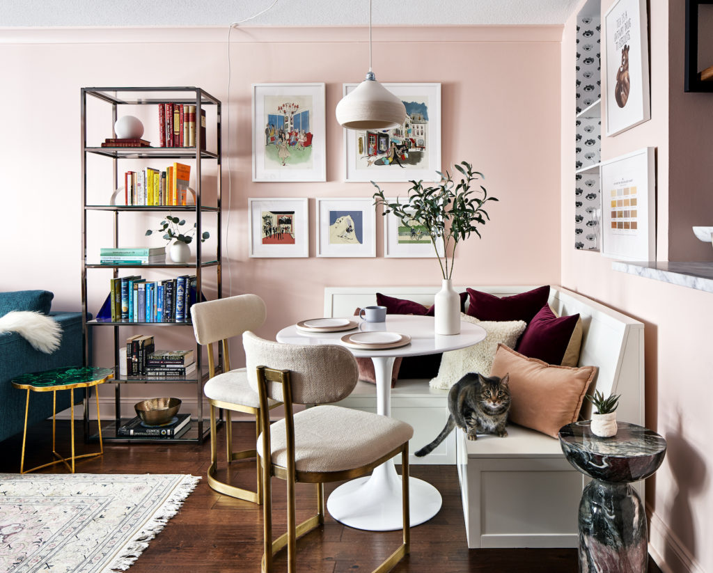 a dining nook beside a bookcase