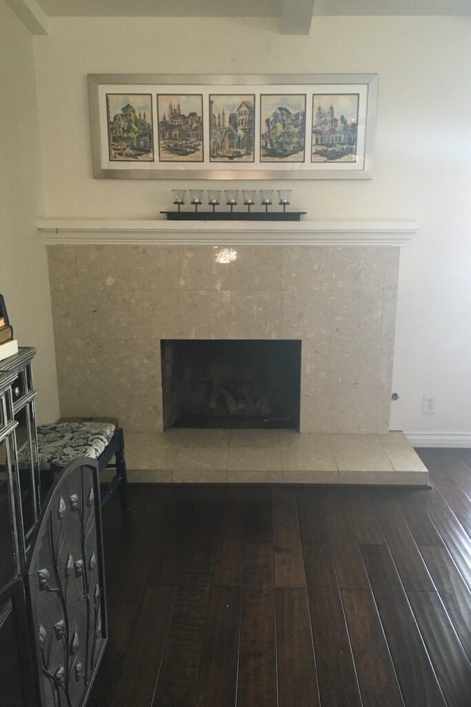 Beige fireplace mantel before