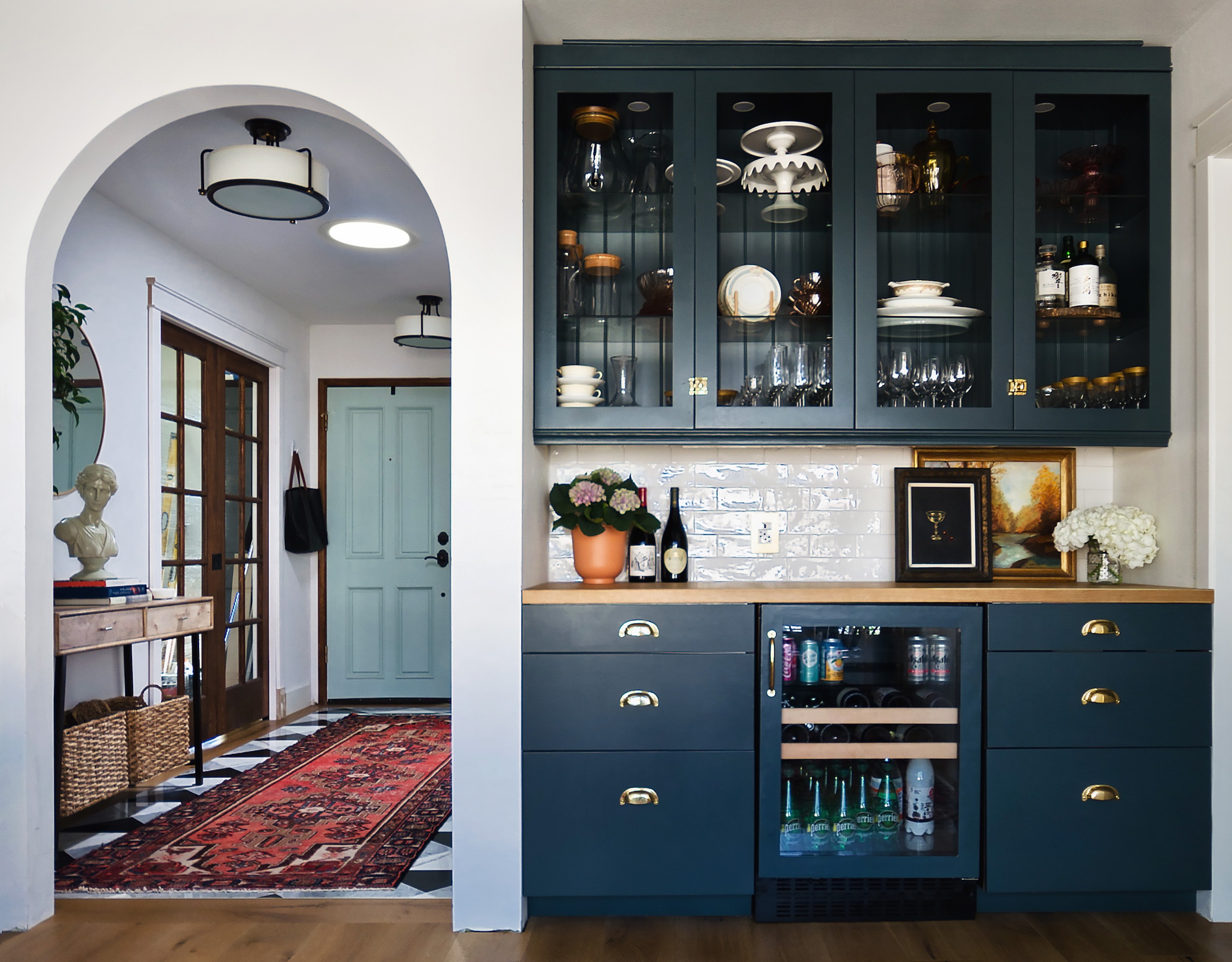 Archway in navy kitchen