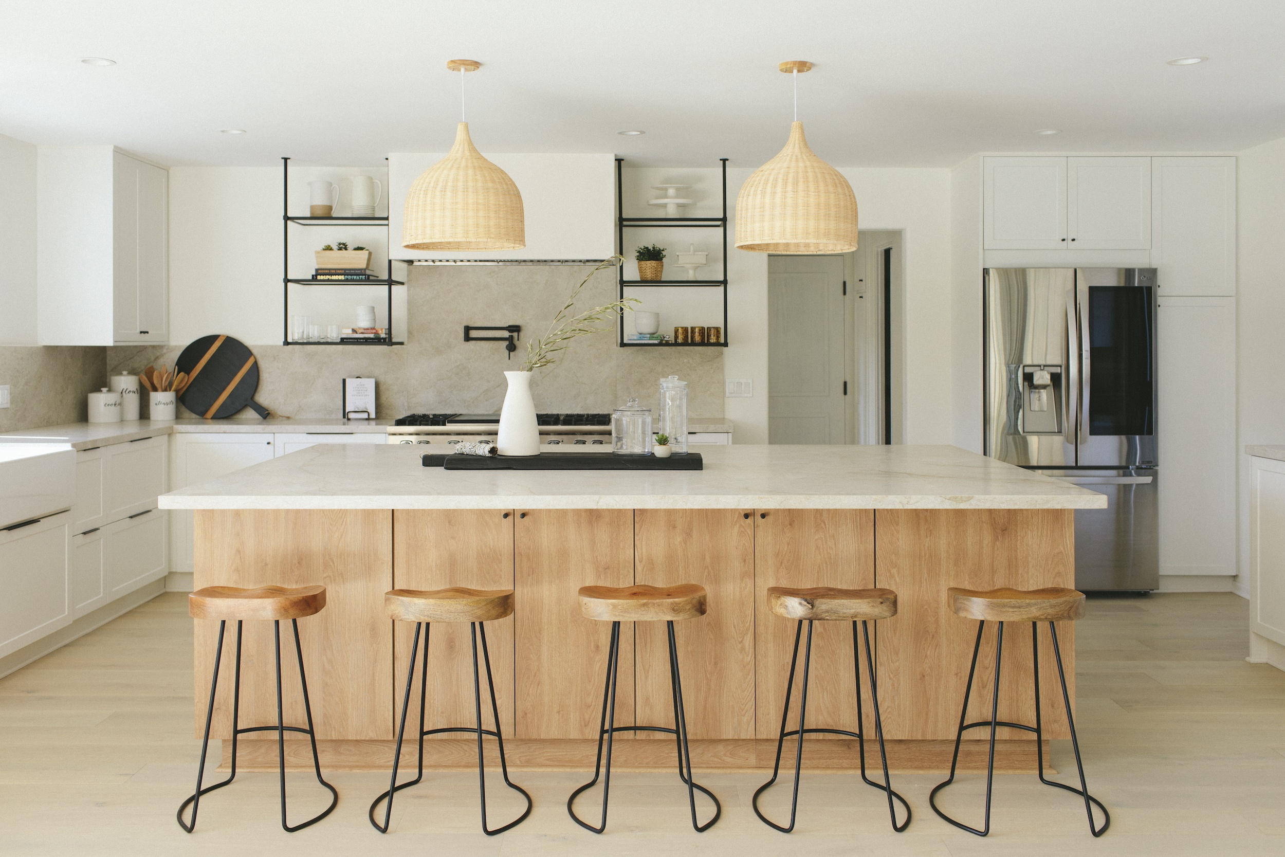 Large white kitchen with wood cabinets