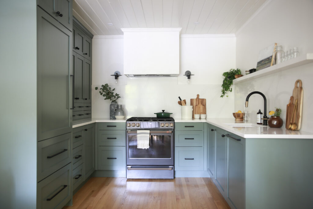 Narrow floating shelf in teal kitchen