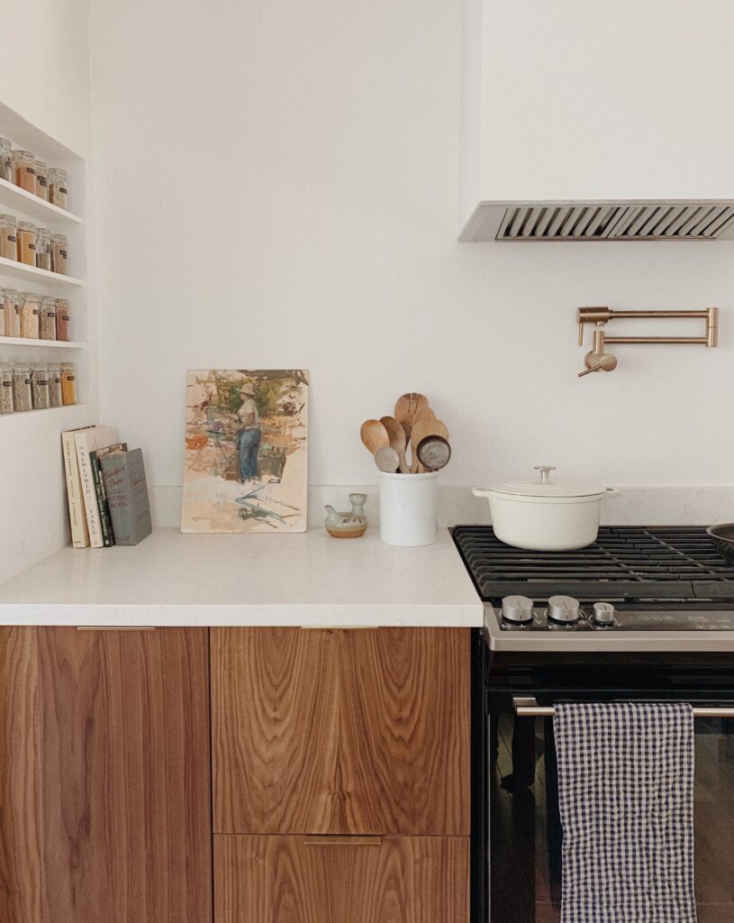 Walnut kitchen cabinets with white countertops