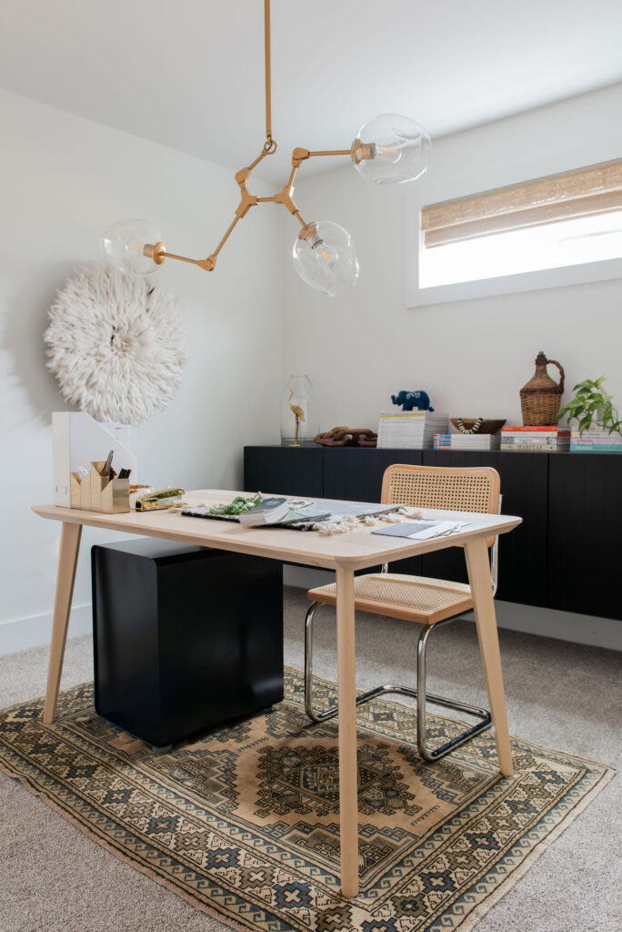 white home office with black storage cabinet