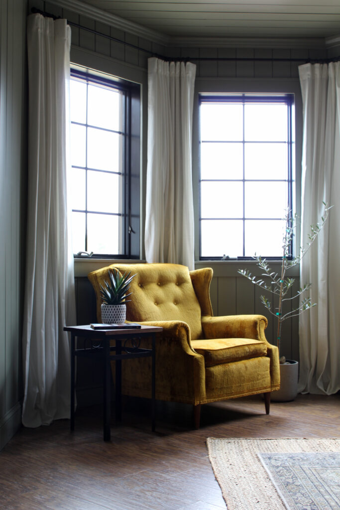 Yellow vintage chair in green home office