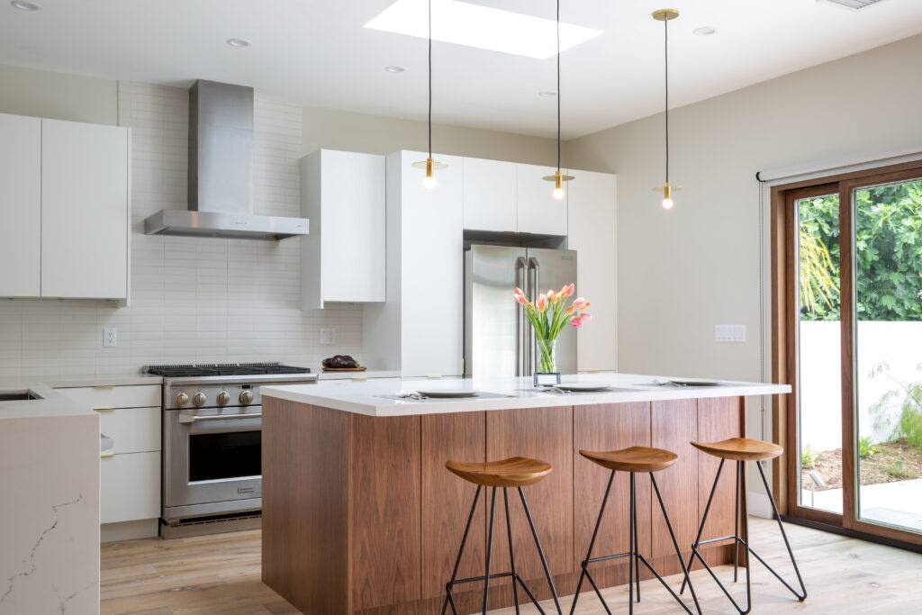 Walnut kitchen island with white cabinets