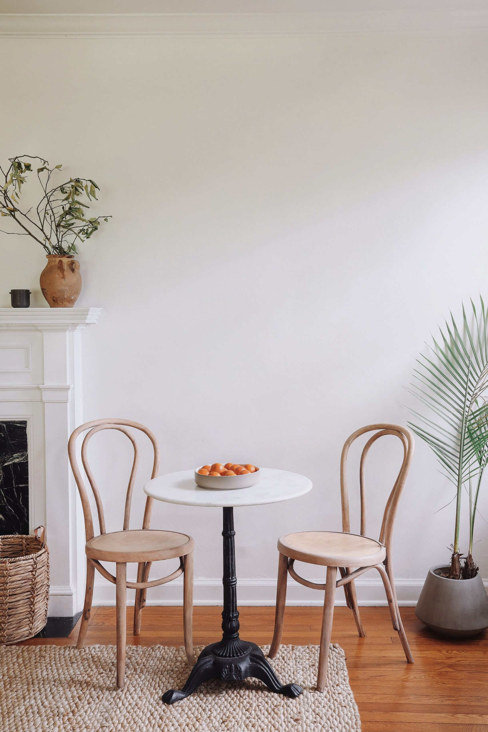 White living room with wood thrifted chairs
