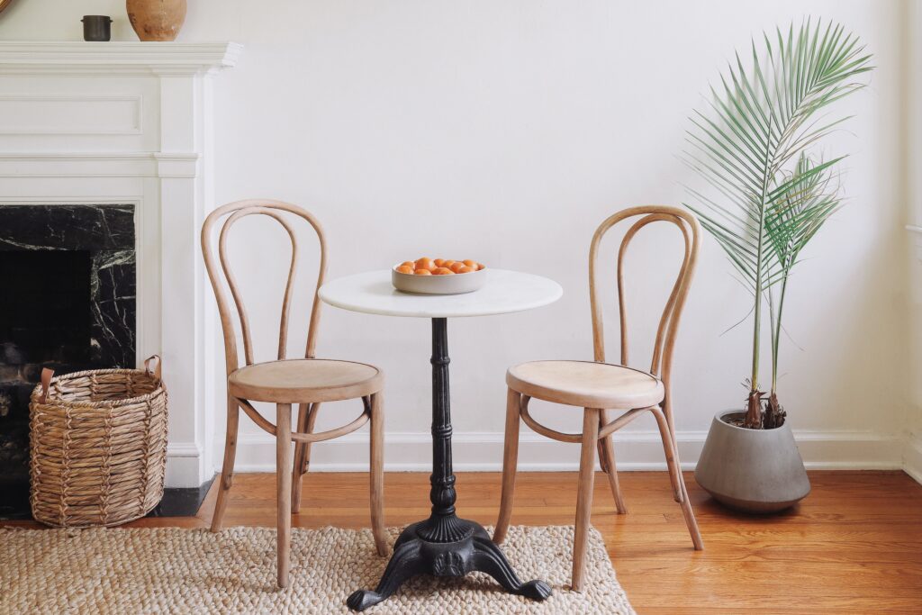 Two finished bistro chairs at a table