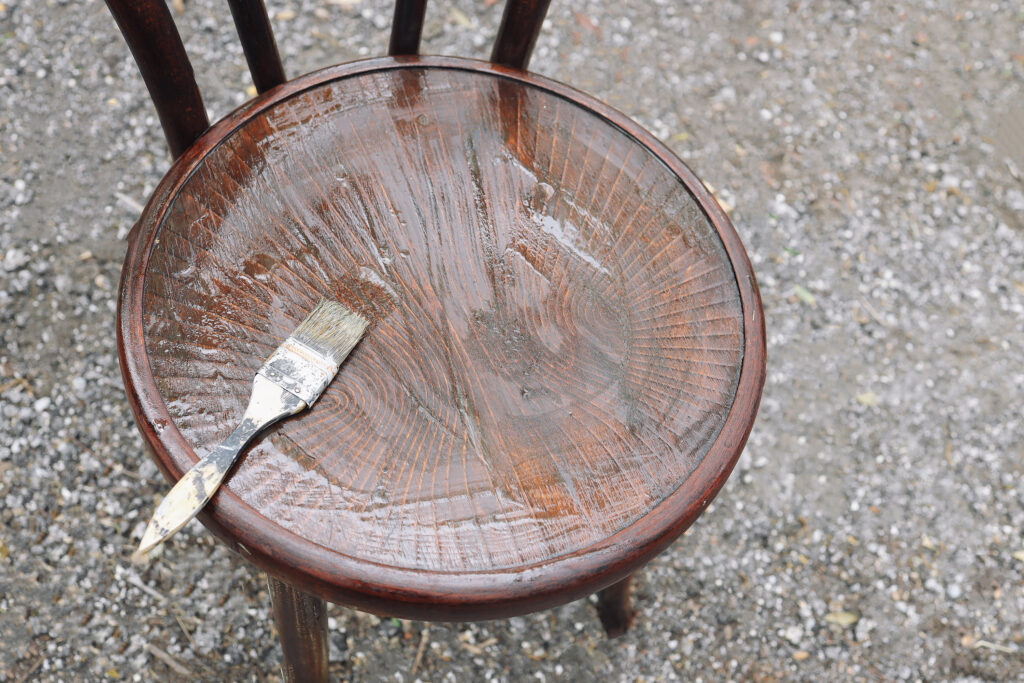 Coat of stripping solution on a wood chair