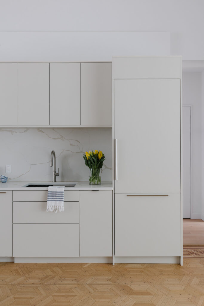 Cream slab kitchen cabinets
