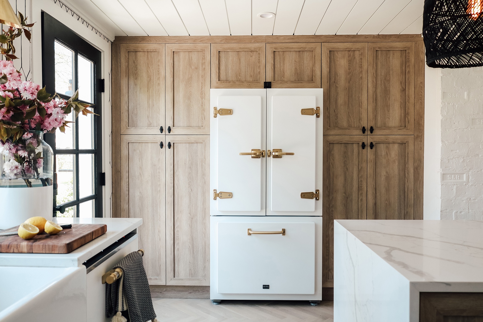 Wall of kitchen storage and white refrigerator