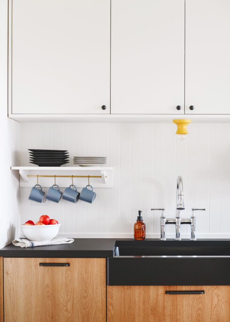 White and wood kitchen with colorful accents