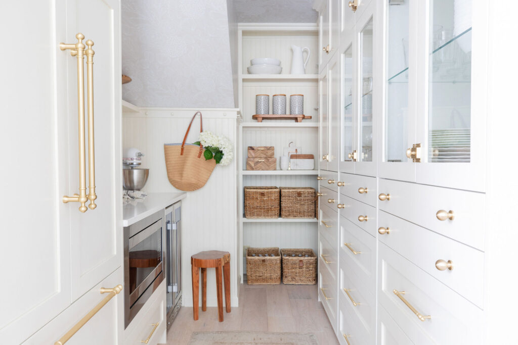 White kitchen cabinet storage in a walk in pantry