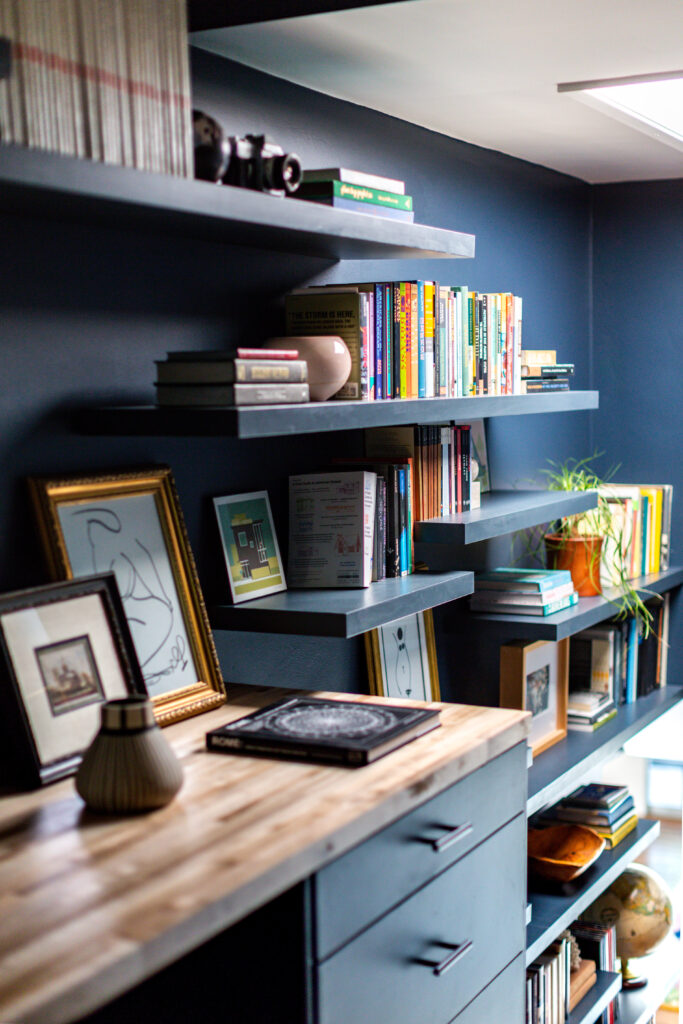 Blue office with desk and shelves