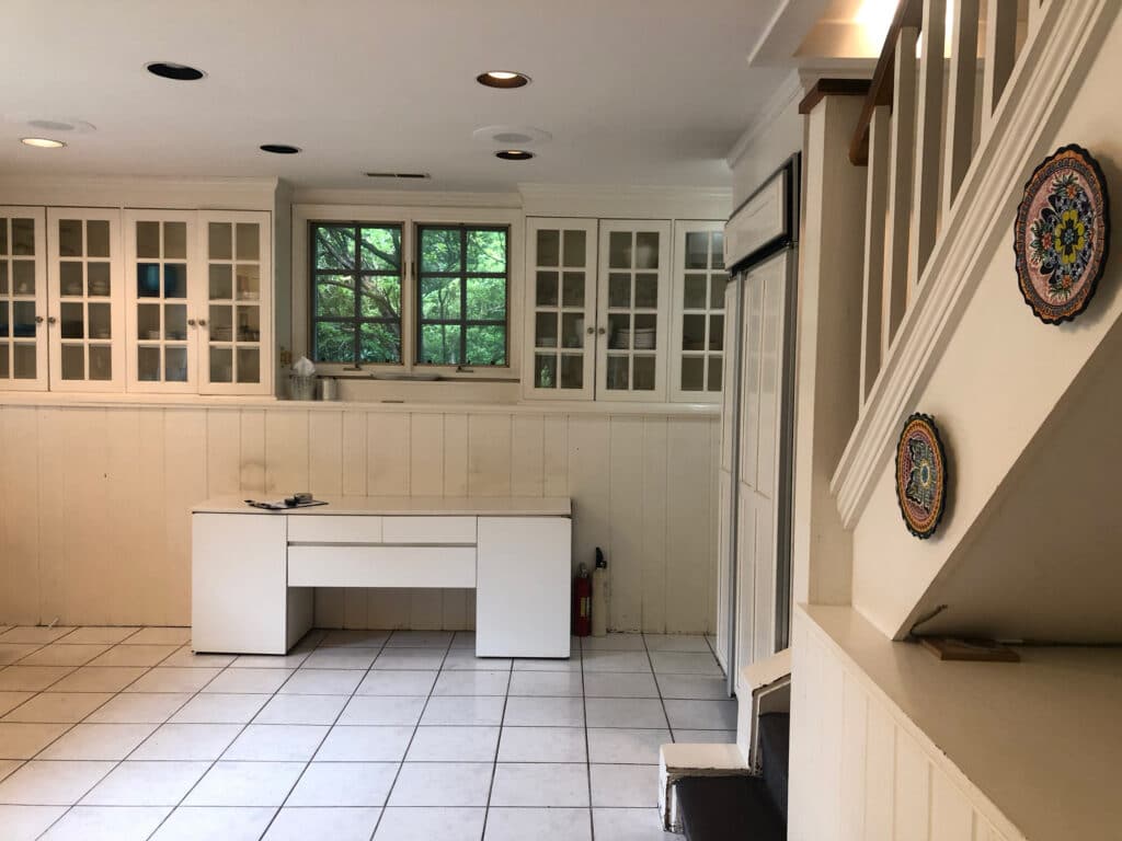 Before view of kitchen back wall and stairs