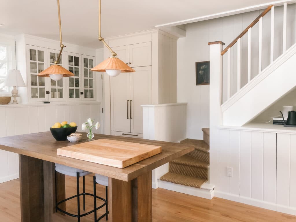 View of cream and white kitchen corner with stairs