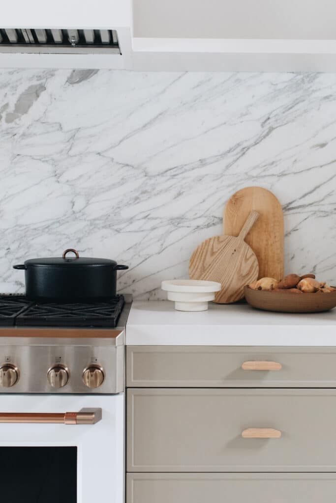Gray kitchen with marble backsplash and counters