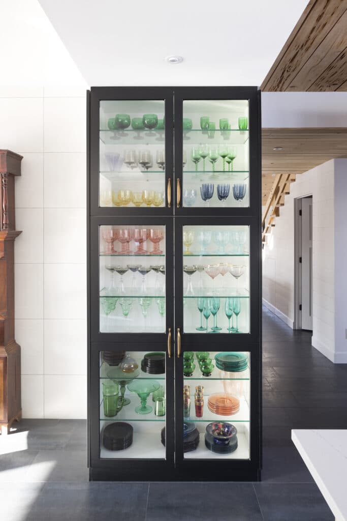 China cabinet with colorful glassware