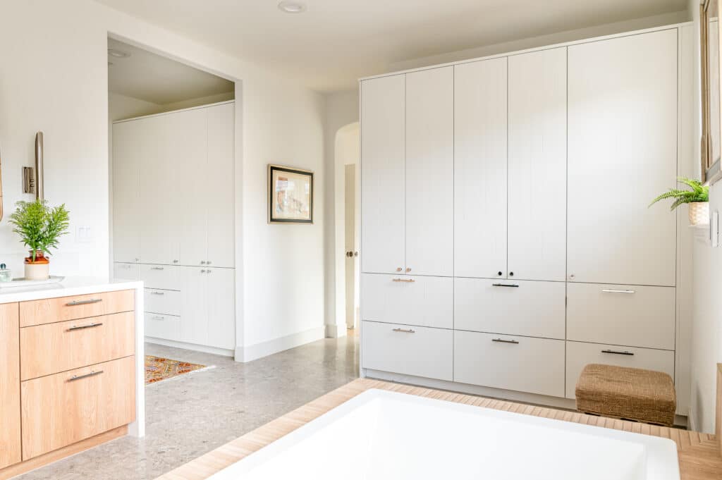 Wall of white cabinets in the bathroom