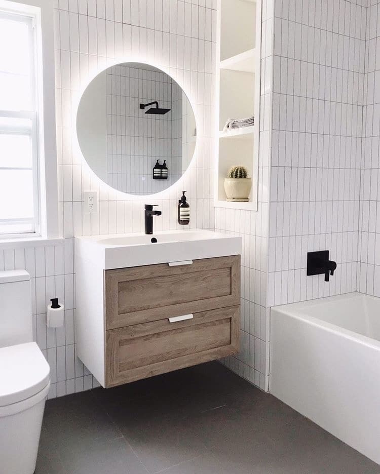 Small wood vanity with an illuminating mirror
