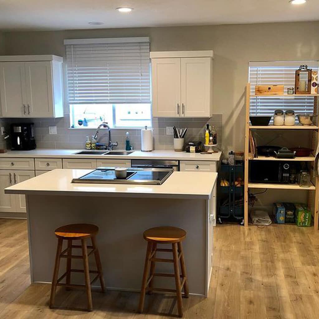 before view of a kitchen that's white and grey