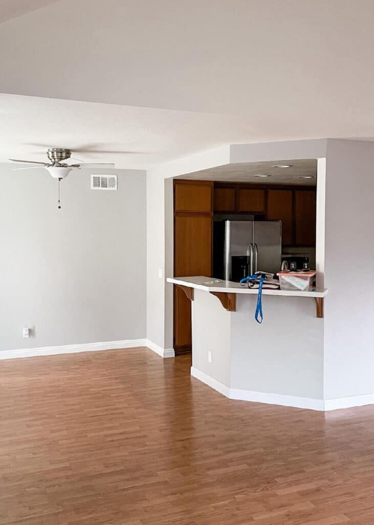 Before view of white and cherry builder grade kitchen