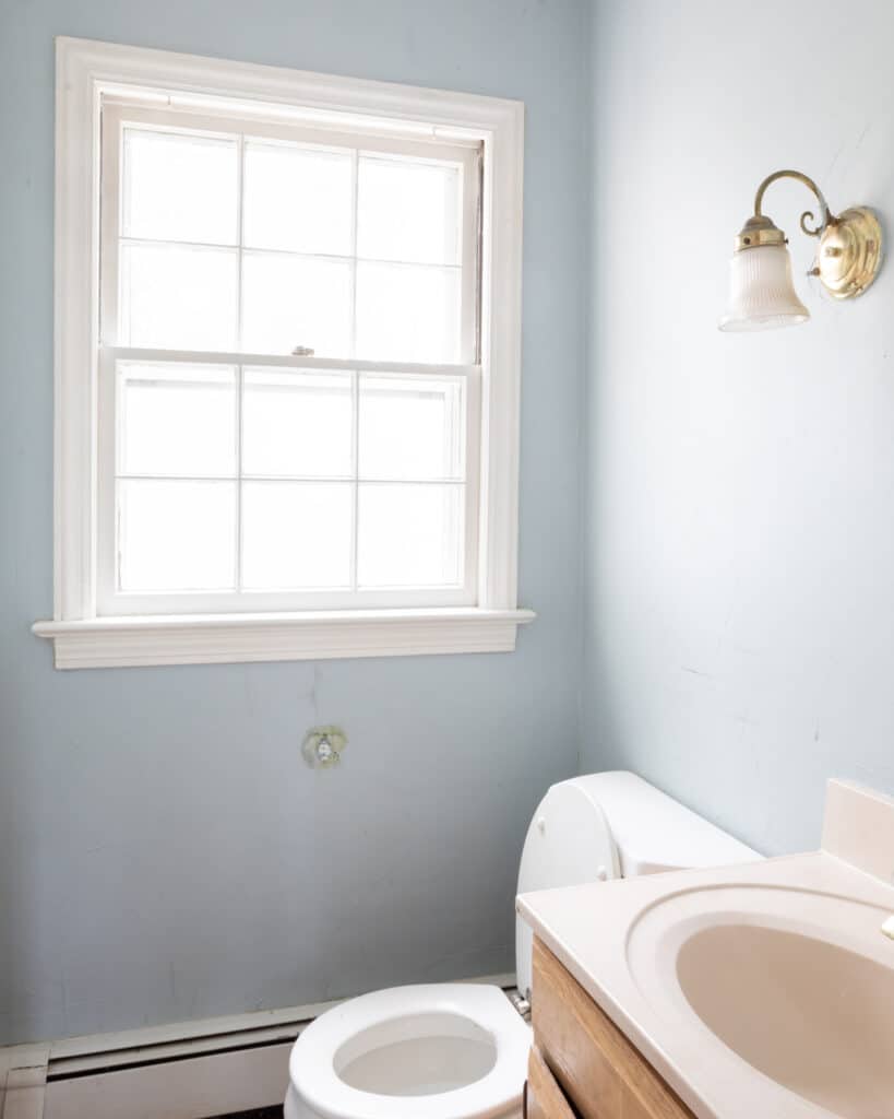 Before view of a light blue powder room