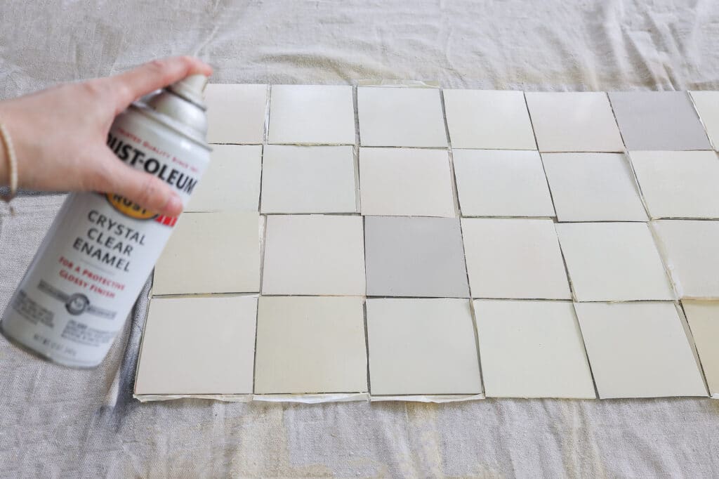 Spraying high gloss finish onto peel and stick tiles