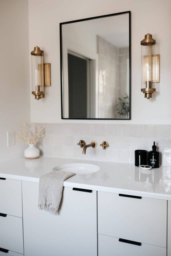 White bathroom vanity storage with black hardware