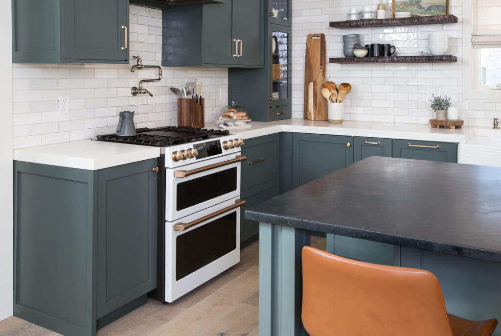 Gray green kitchen cabinets corner view