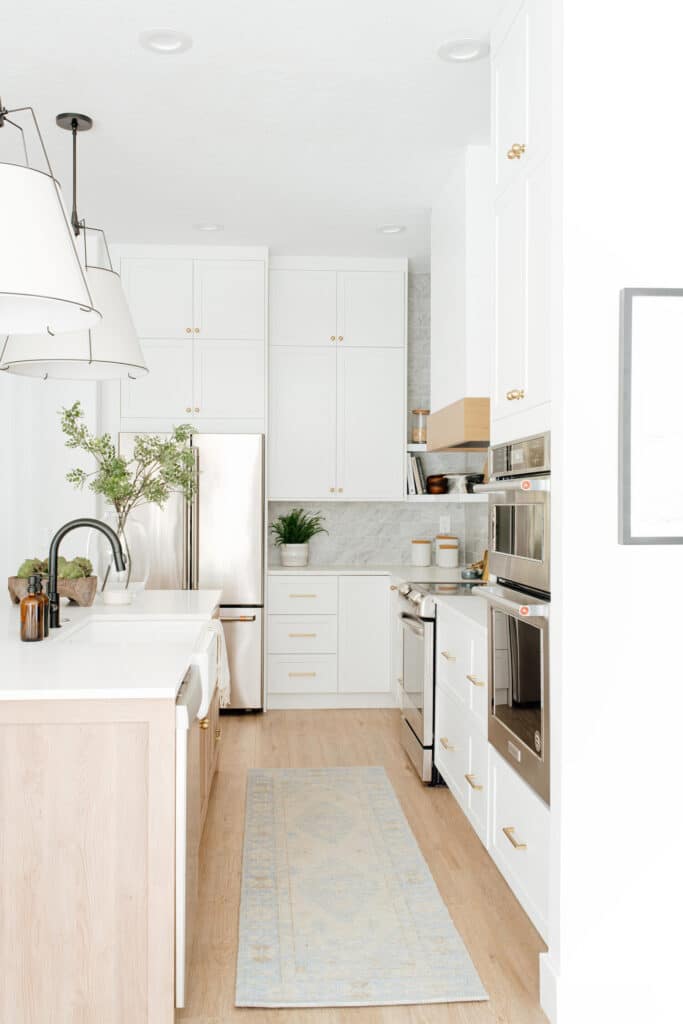 White and wood kitchen with lots of built in storage