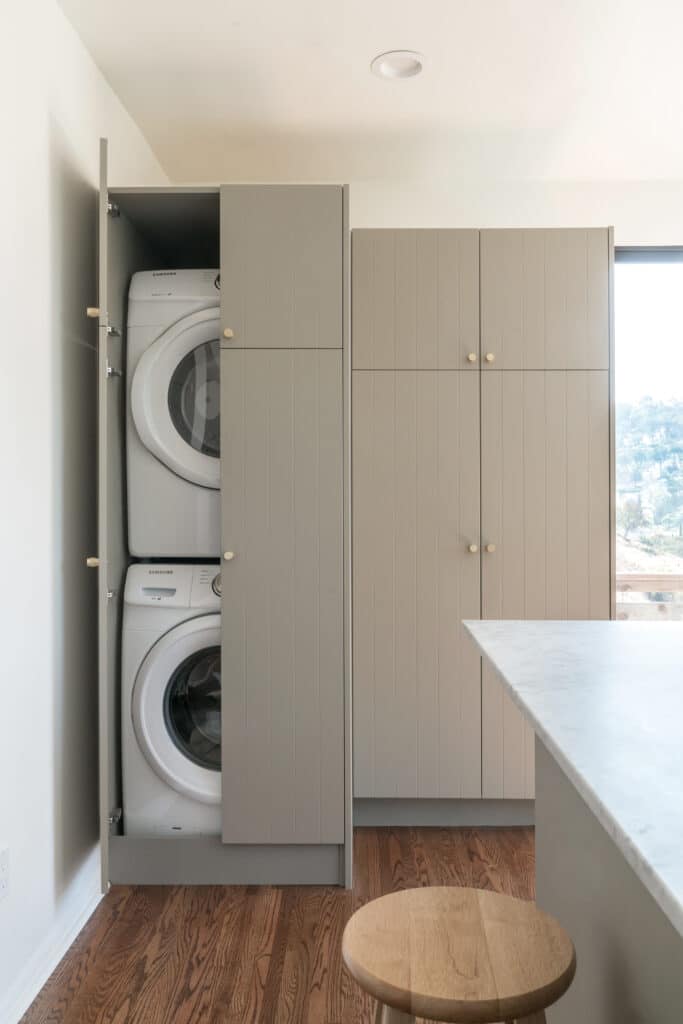 Laundry in a cabinet in the kitchen
